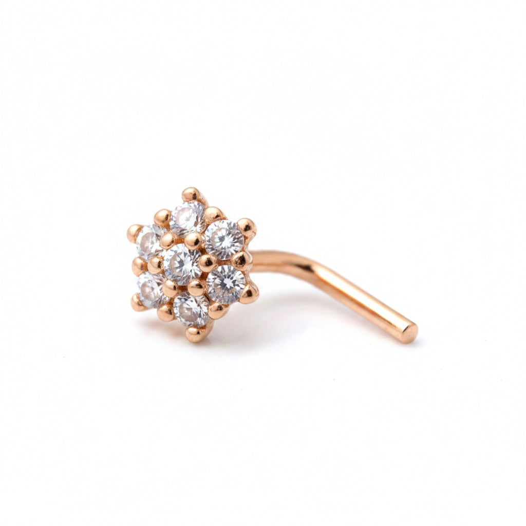 Rose gold nose ring with clear gemstones on a white background